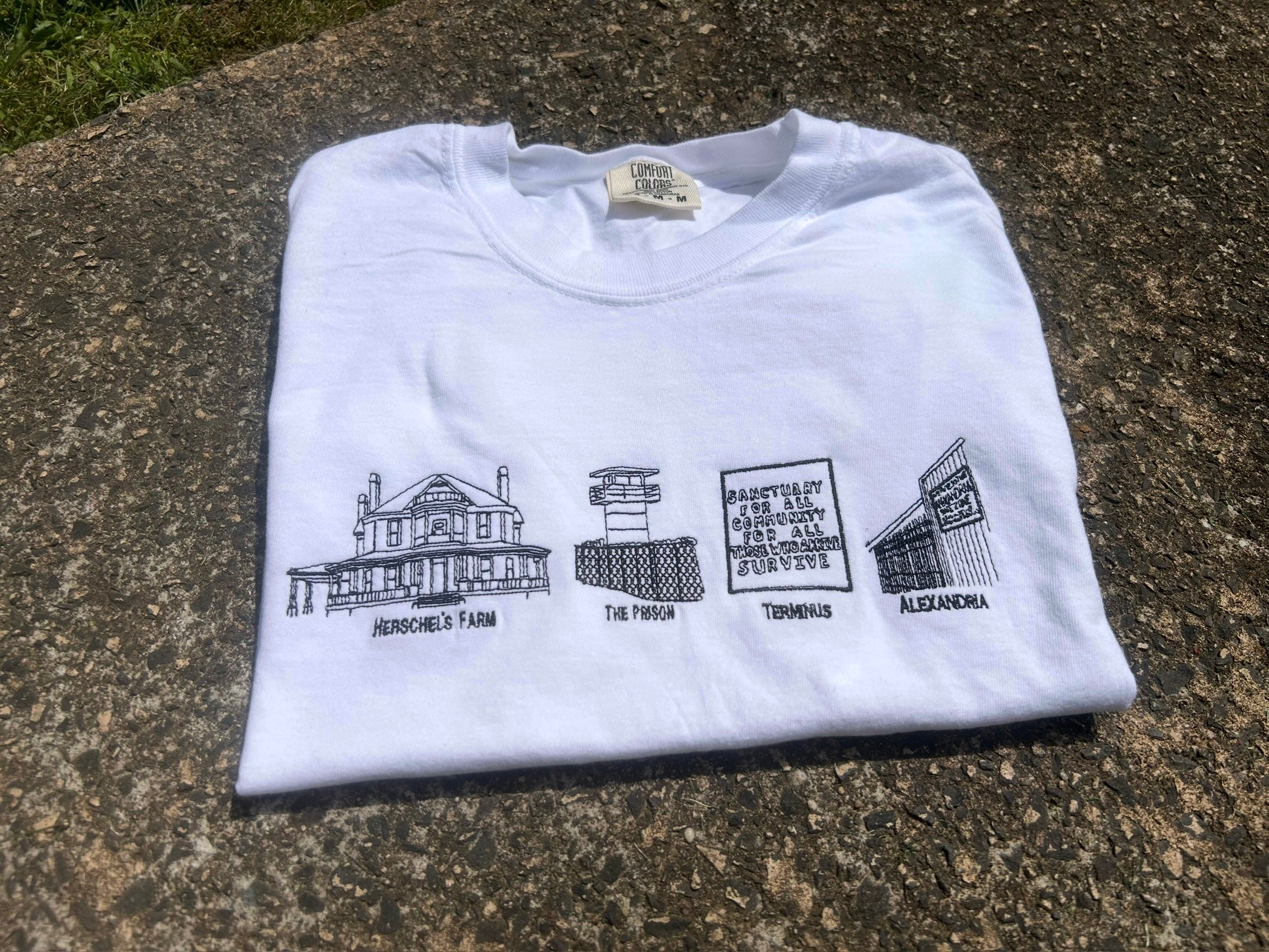 The Walking Dead Safe Zones Embroidered Tee – Hershel’s Farm, The Prison, Terminus, Alexandria