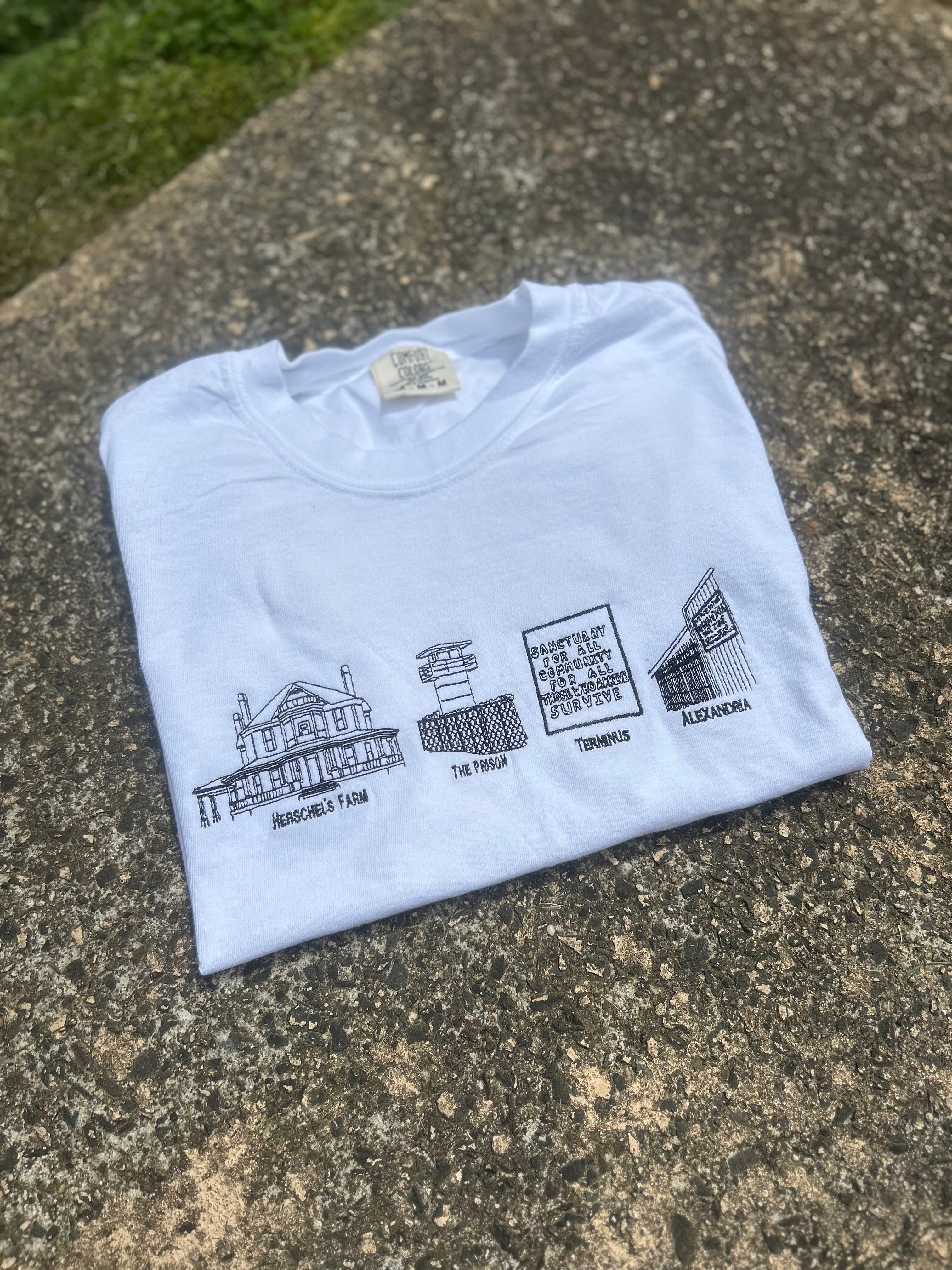 The Walking Dead Safe Zones Embroidered Tee – Hershel’s Farm, The Prison, Terminus, Alexandria